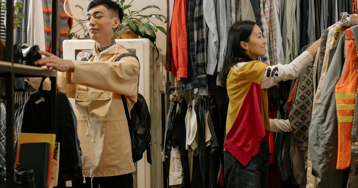 Couple modeling thrift store outfits