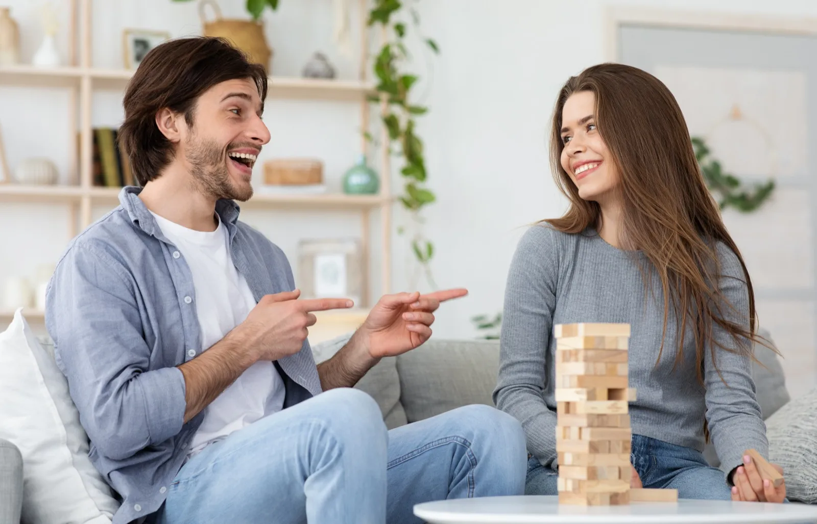 Couple playing card and board games at home - 52 memories anniversary gift idea