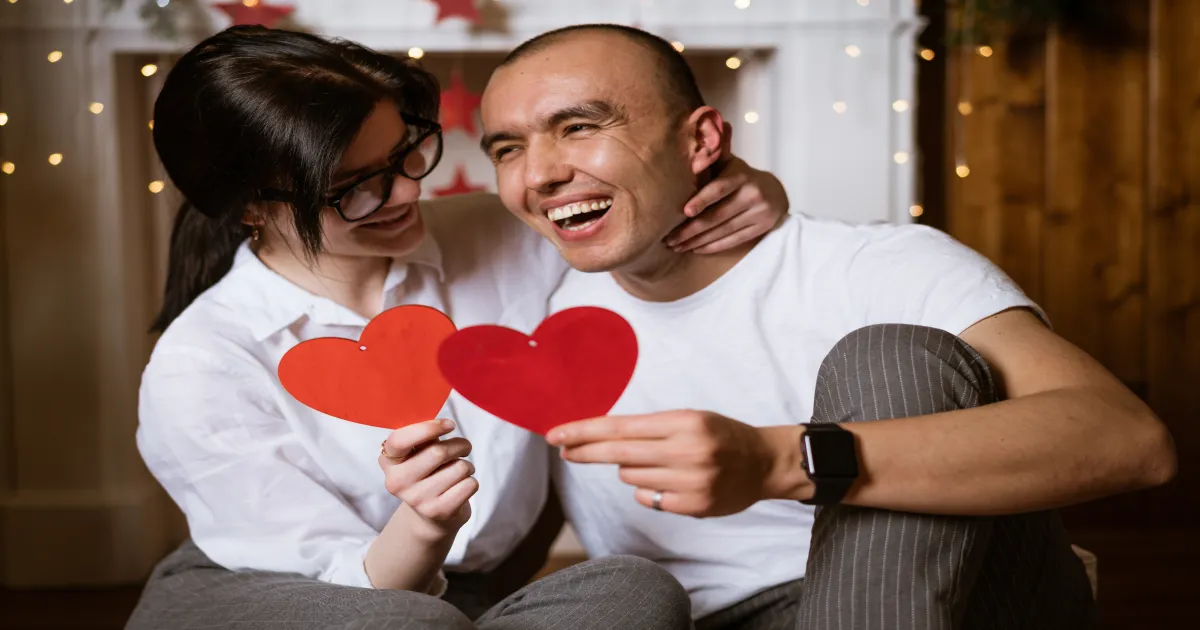 Couple exchanging love letters on Valentine's Day
